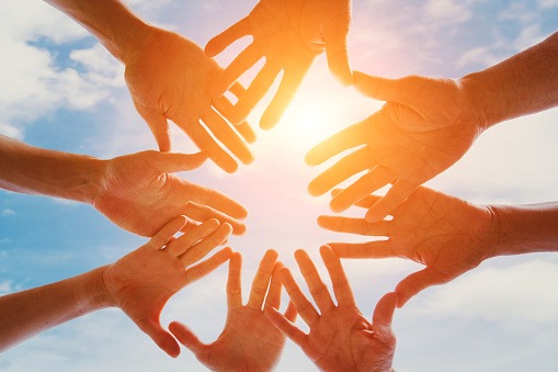 Team hands together, community and unity concept