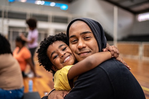 Portrait of father and daughter embracing
